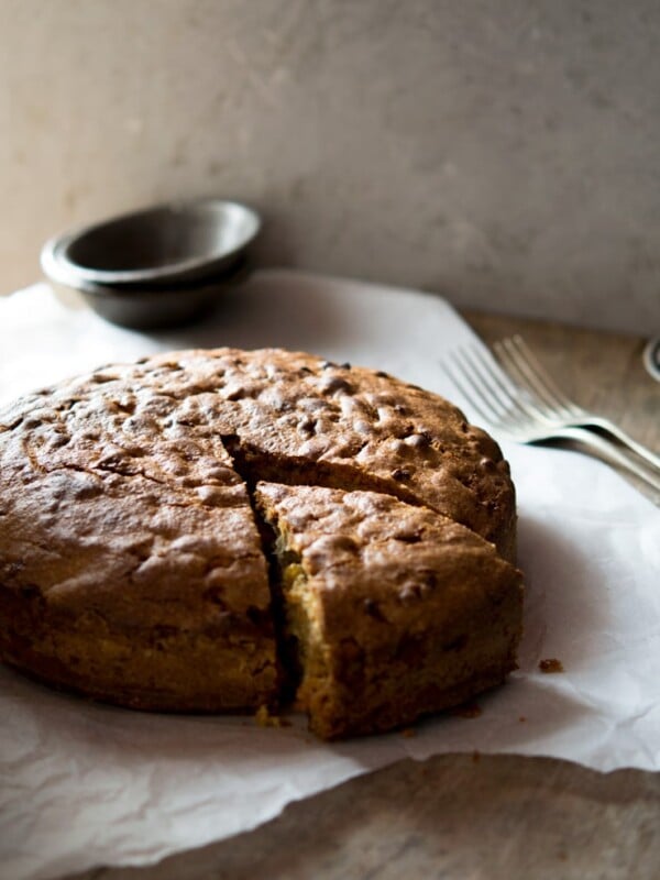 A rustic Italian apple olive oil cake recipe made with cinnamon and sultanas it's absolutely perfect for breakfast or dessert with a hot cup of coffee. Find the recipe for this authentic Italian apple olive oil cake and more traditional Italian recipes at Inside The Rustic Kitchen.