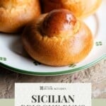 A Pinterest graphic of Sicilian brioche buns on a plate.